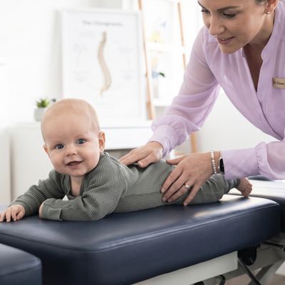 Professional chiropractic care for babies, showing a gentle adjustment to highlight the benefits of pediatric chiropractic treatment.