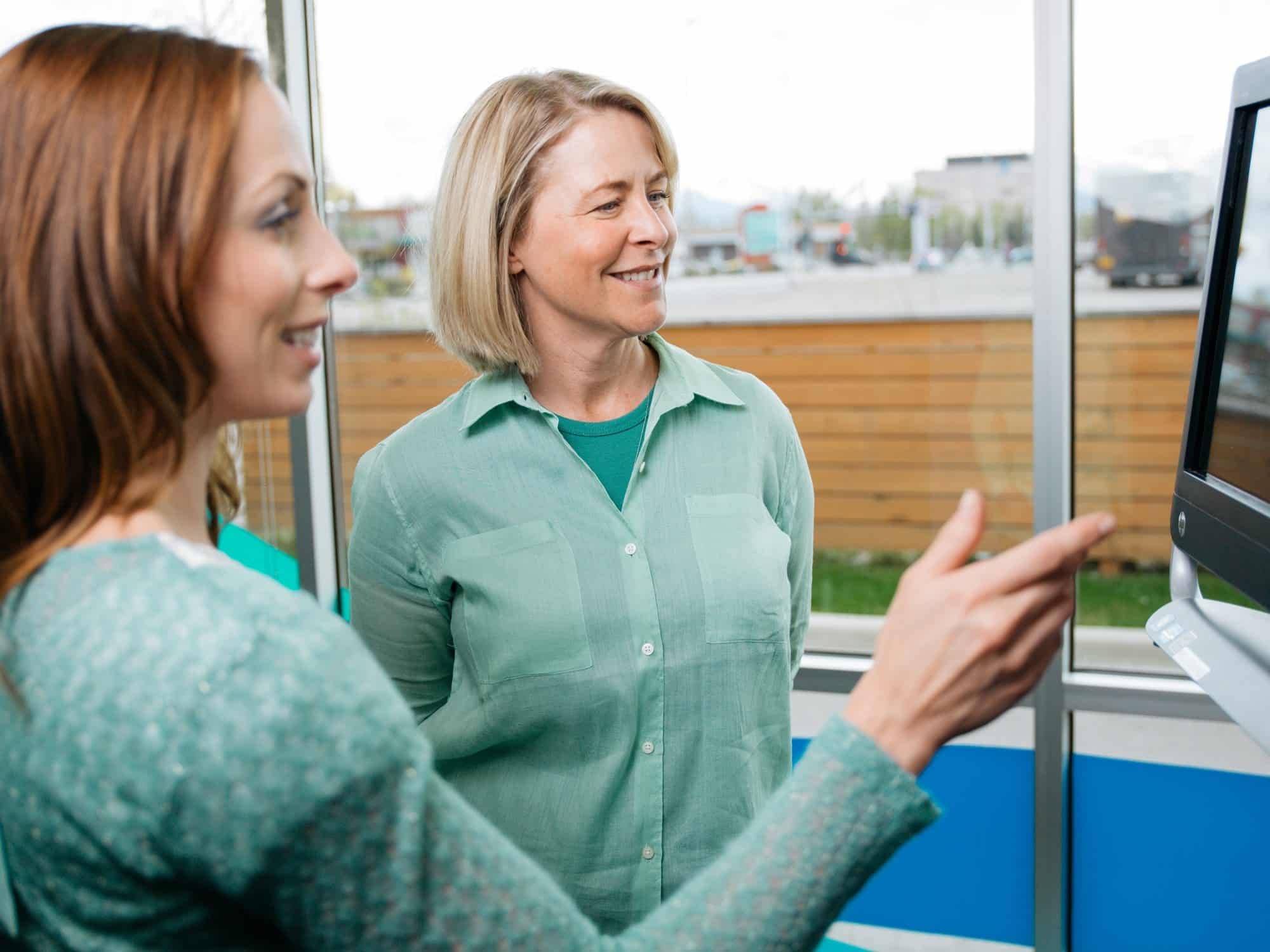chiropractic-review-of-findings Patient meeting with a chiropractor to review examination findings and discuss the next steps in care.