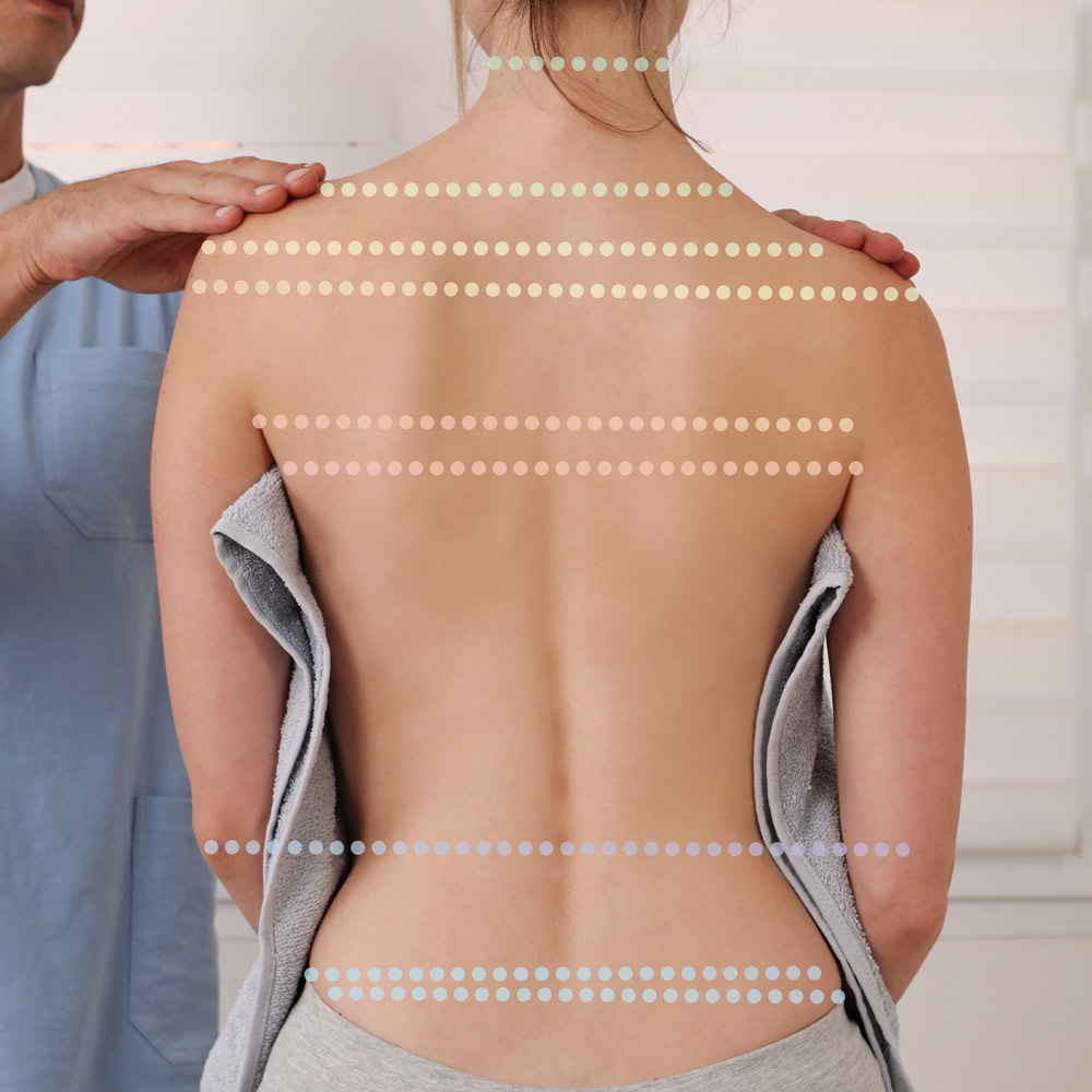 corrective-chiropractic-in-anchorage-ak Chiropractor performing a posture assessment for corrective chiropractic care at Whole Family Chiropractic in Anchorage, AK