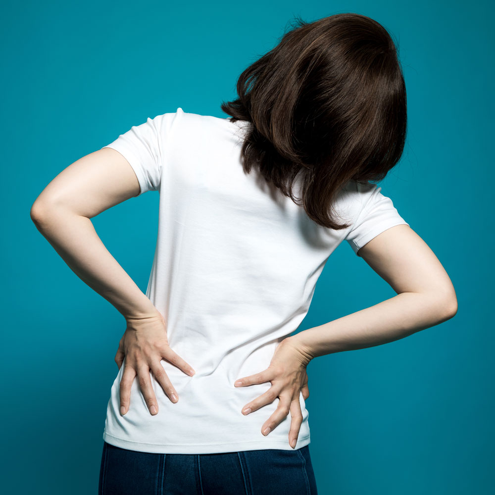 Woman suffering with back pain and a bulging disc – Whole Family Chiropractic in Anchorage AK Woman suffering with back pain and a bulging disc - Whole Family Chiropractic in Anchorage AK